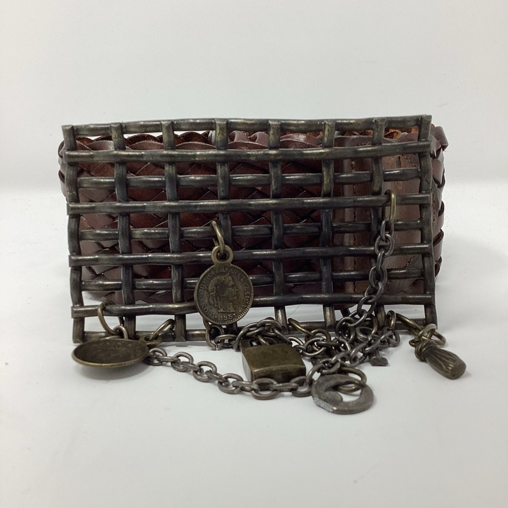 Woven wide leather belt with brutalist buckle.
